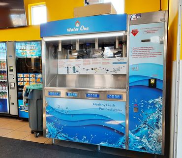 commercial vending machine (ws-3000) next to other vending machines in laundromat