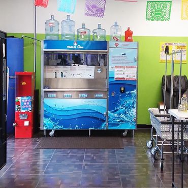 Commercial water vending machine (model ws-3000) in coin laundry with green wall