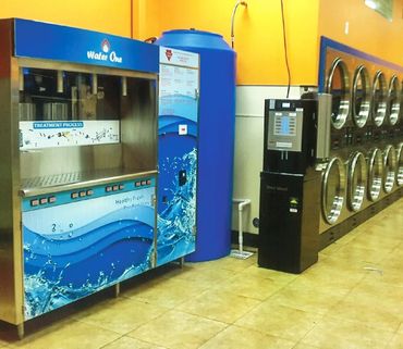 Commercial water vending machine (model ws-3000) in coin laundry with gold wall
