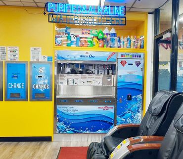 Commercial water vending machine (model ws-3000) in coin laundry with yellow wall