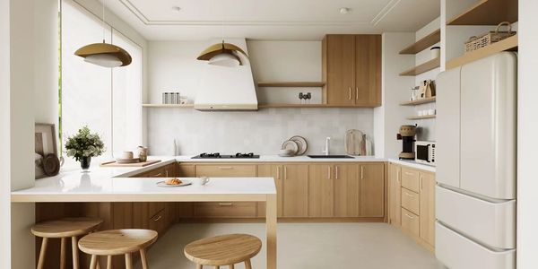 Warm wood and white kitchen cabinetry with an island and integrated storage.