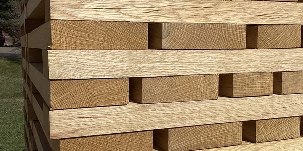 Stack of lumber at Trumbull County Hardwoods, a timber buyer, logging company, and timber company