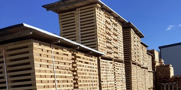 Stack of lumber at Trumbull County Hardwoods, a timber buyer, logging company, and timber company