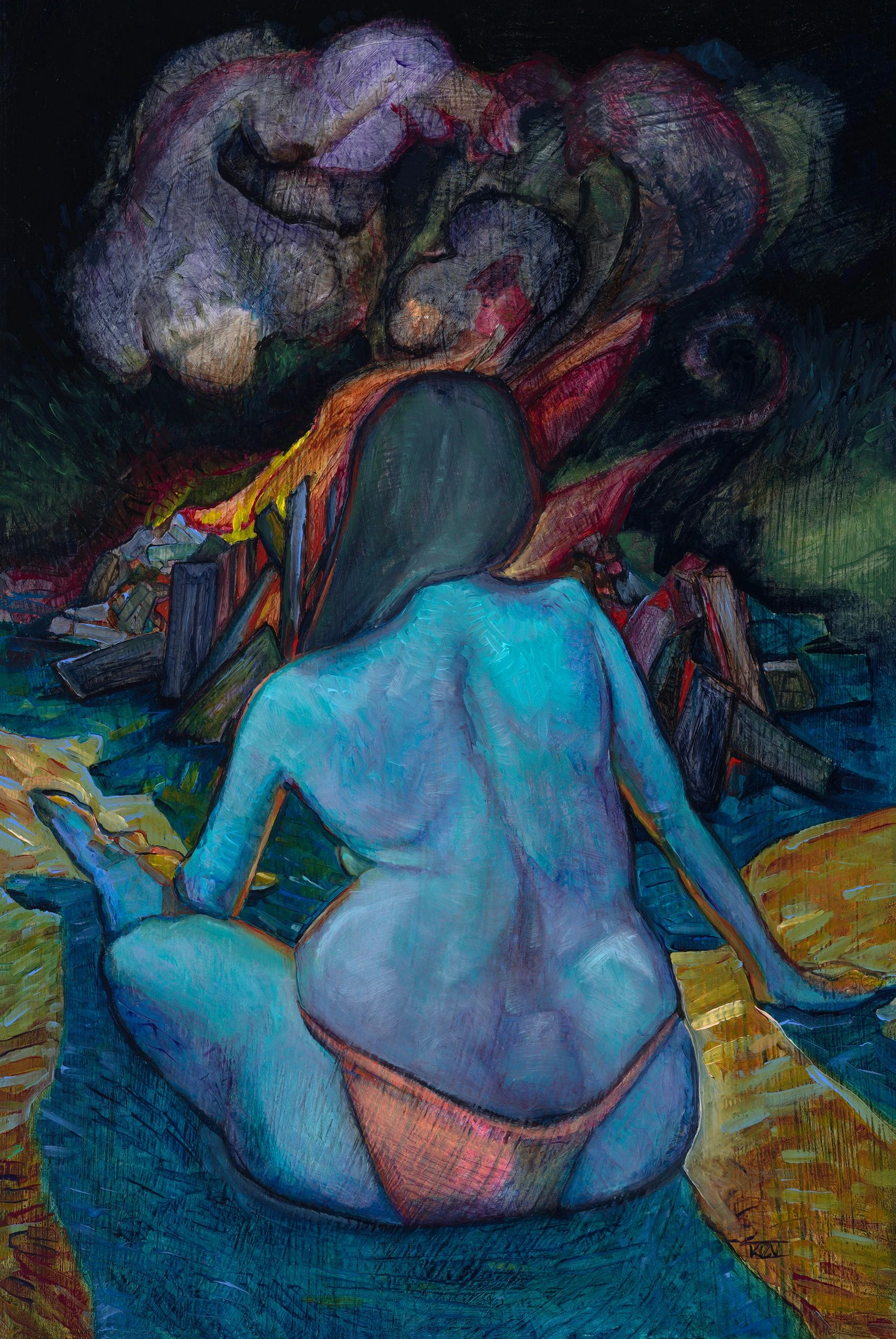 Woman sitting by campfire