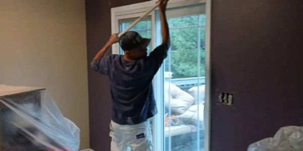 Smooth Finish professional painter showing his skills as he paints a home in Merrillville Indiana.