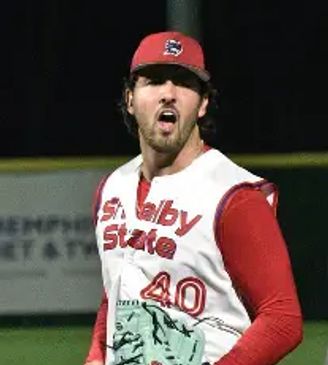 Shelby State baseball player in pitch action.