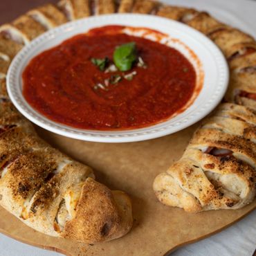 BanginBoli signature stuffed dough ring with Italian seasoning and dip