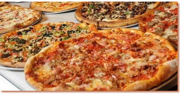 Variety of fresh pizzas on display at TJ’s BanginBoli pizzeria
