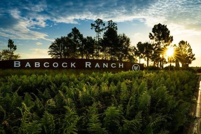 Sunset over Babcock Ranch with lush greenery.