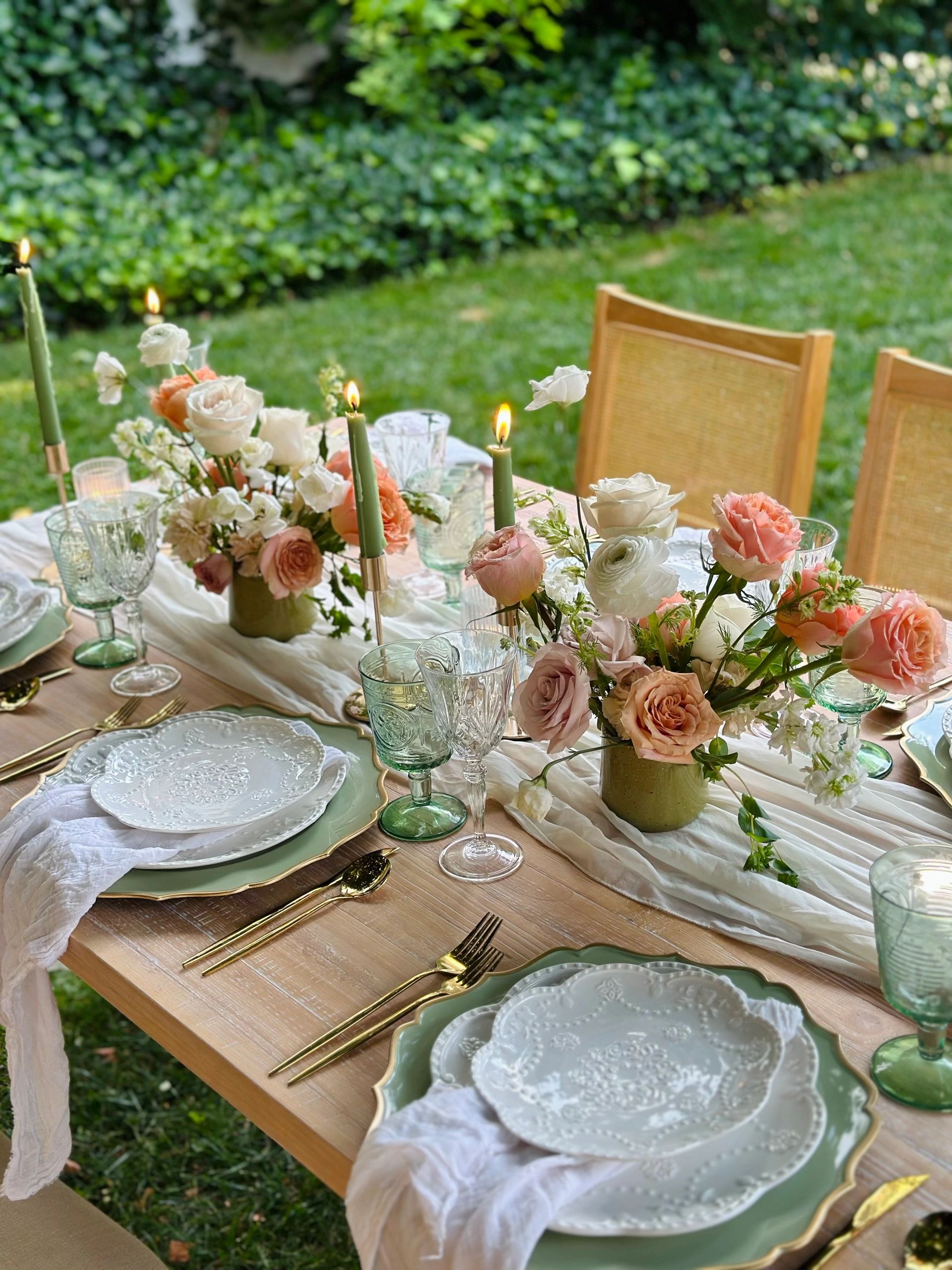 Tablescape with florals and candlelight for a gathering in NYC, designed by Une Table by Tania.