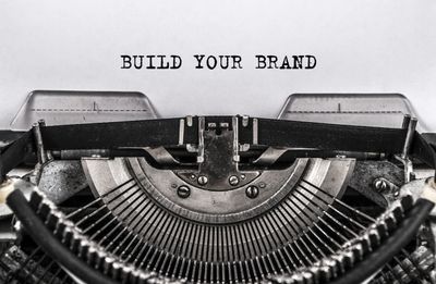 Type writer with paper reading build your brand trademark patent attorney