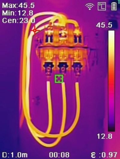Infrared thermal image of electrical equipment and conductors from a Mid City Electric inspection.