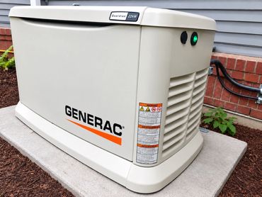 Retouched project photograph of a standby generator beside a home.