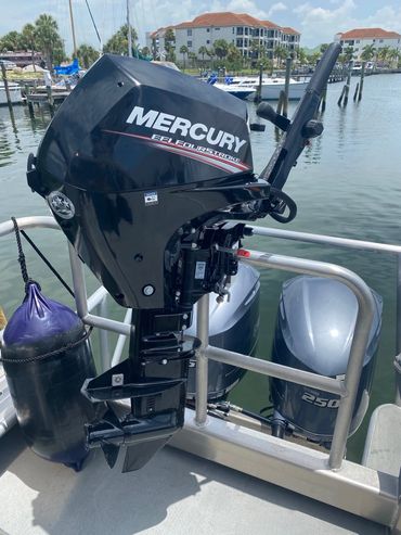 Munson Fireboats's Dingy Motor mounted on T rail Bracket