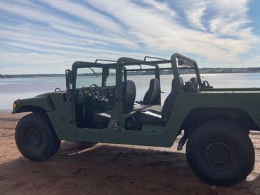A parked Hummer car in the beach