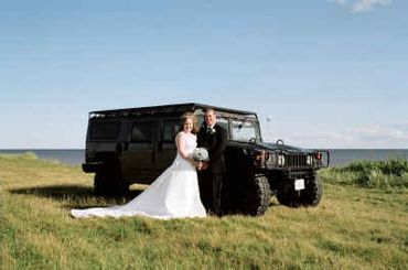 A couple standing a vehicle