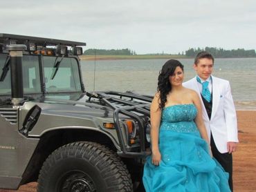 A couple wearing blue attire with blue gown