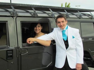 A person inside a car with a person outside