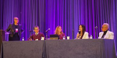 Speakers for the 2024 FWCA Roundtable Discussion sit on a panel alongside the host who stands