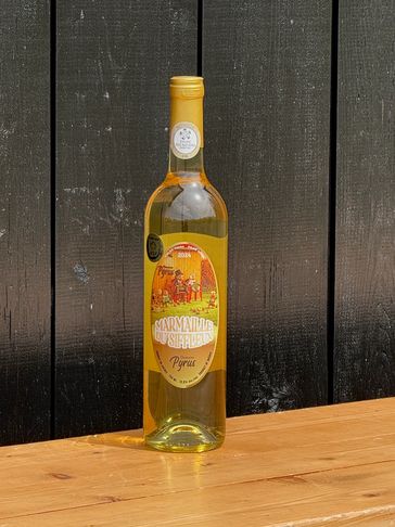 A bottle of Marmalade Muscatel with Pyrus label on a wooden table.