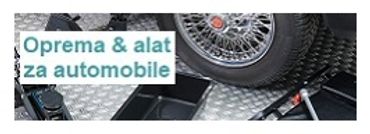 Automotive tools and equipment displayed with a car wheel in the background.