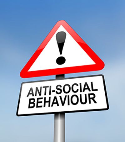 Warning sign indicating anti-social behaviour.