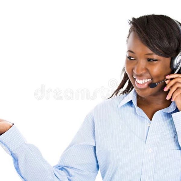 Smiling woman wearing headset, gesturing with hand.