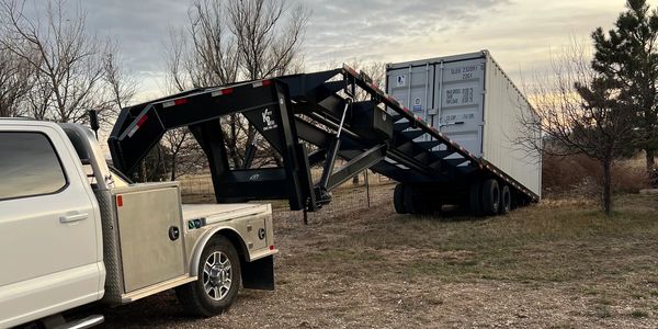 We delivery Shipping Containers from Newcastle to Hulett using self-unloading trailers