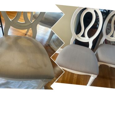 Two white chairs with checkered fabric seats on a wooden floor.