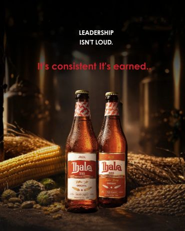 Two Thala beer bottles with a leadership quote.