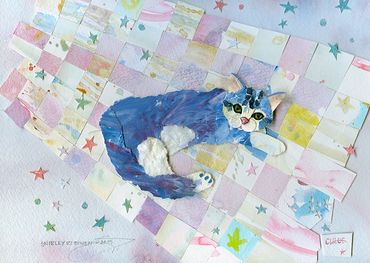 A mixed media creation of a cat laying on a colorful paper quilt.