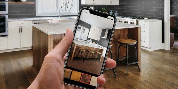 Cell phone app for interior design assistance with porcelain tile and granite island.