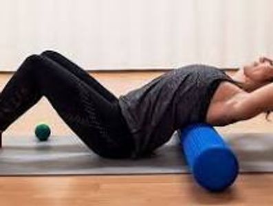 Using a roller to massage the spine, creating better joint health and movement!
