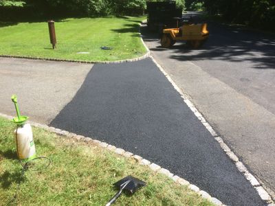 Saw cut, tear out the old asphalt, and replace apron of driveway aka patch blacktop 