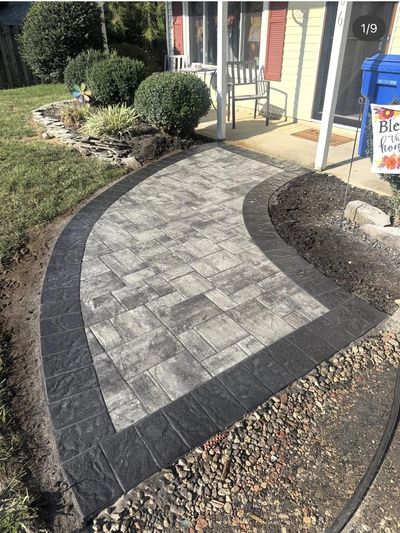 Brick paver walkway installed in Dover, DE with decorative border. Built with proper base prep.