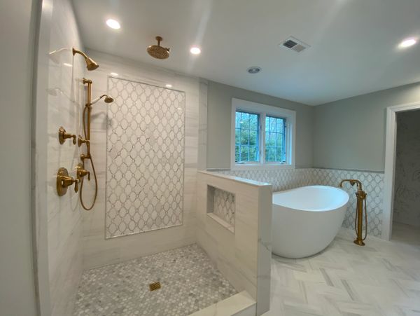 Marble Carrara Tile on Shower, Hallwall and Floor of Luxurious Bathroom