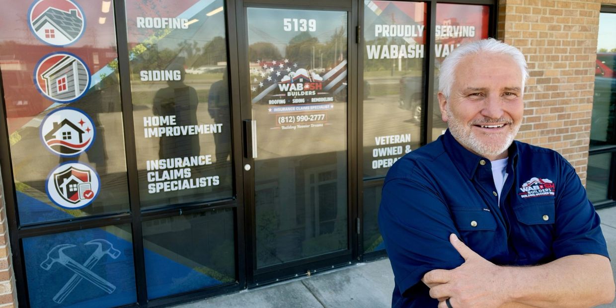 Smiling man standing outside Wabash Builders office.