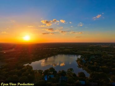 Beautiful sunset and reflections of the clouds over Leisure lake