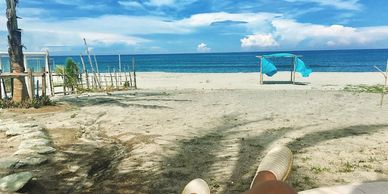 Relaxing beach view with clear skies and calm sea.