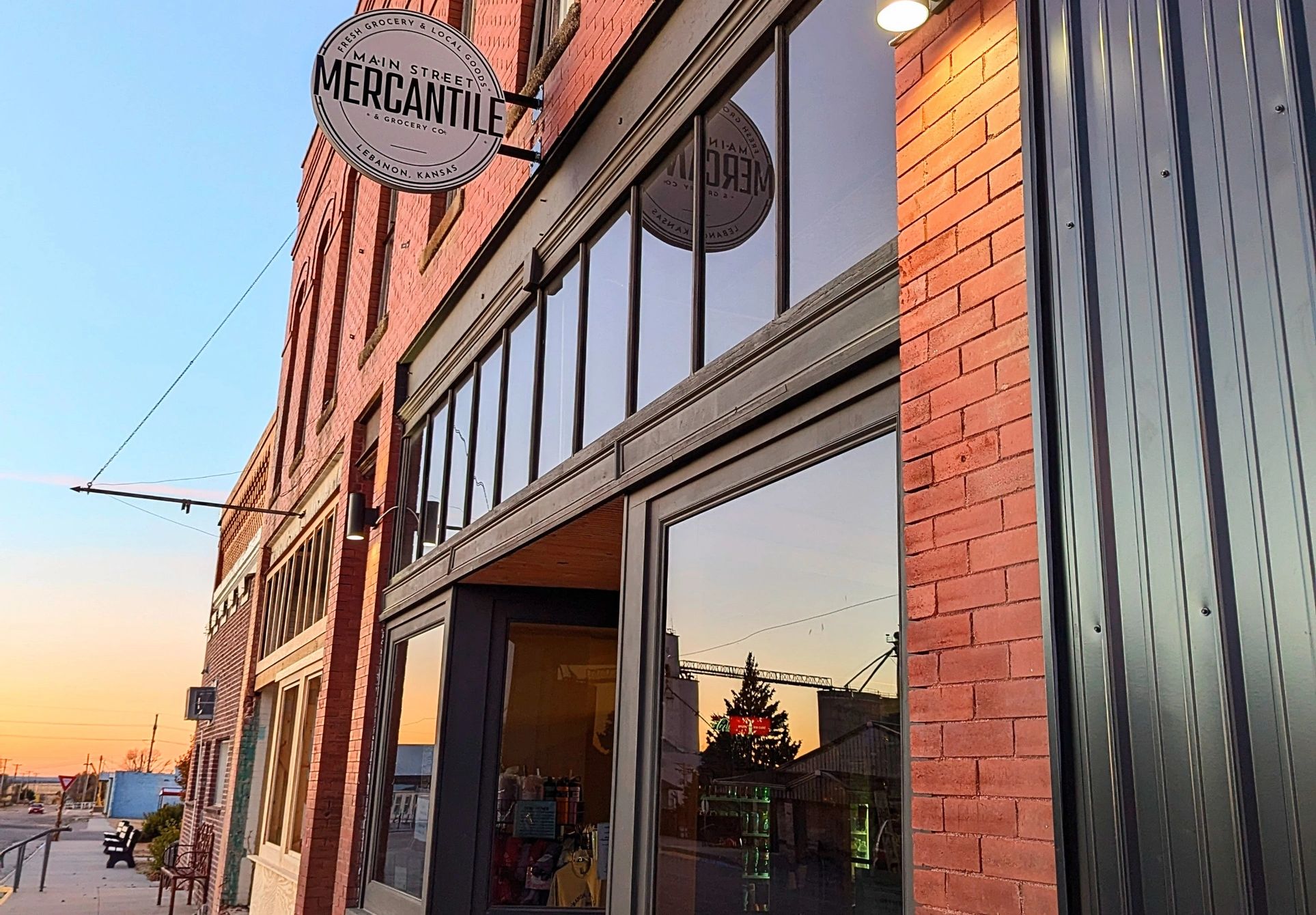Main Street Mercantile’s brick storefront and hanging sign in Lebanon, Kansas.