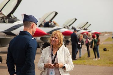 Town of Islip Supervisor, Angie Carpenter speaks to a Thunderbird pilot at the Islip Airport.