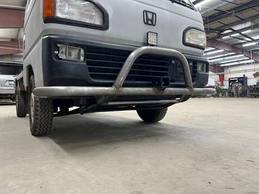 Honda mini truck with custom front bumper.