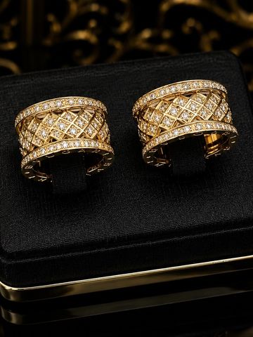 Elegant gold rings with diamond accents on a black velvet display.