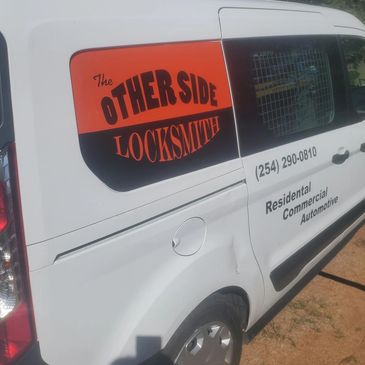 The Otherside Locksmith logo on van