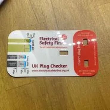 UK Plug Checker safety card for electrical testing.