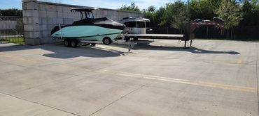 open air storage with boats on concrete pads