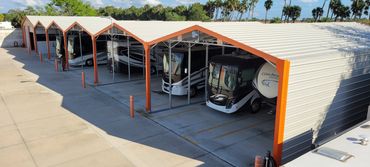 Covered storage with RVs inside with concrete pads