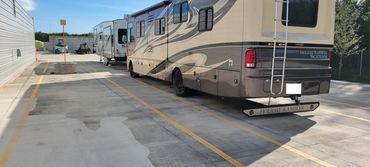 open air storage with RVs and boats with concrete pads