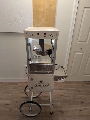 Vintage-style Vevor popcorn machine on wheels.