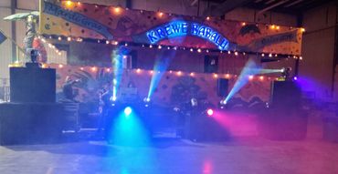 Colorful Mardi Gras Krewe Babalu float with lights and fog effects.